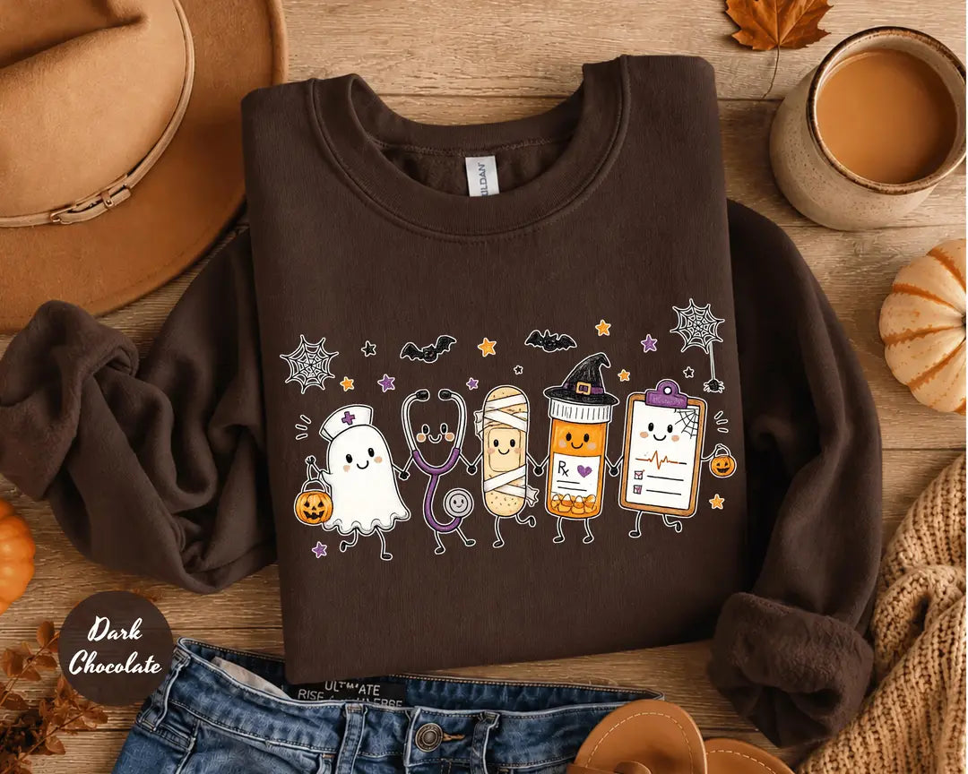 Dark Chocolate crewneck sweatshirt with a ghost, stethoscope, bandage and medical chart characters with Halloween details, flat lay view.