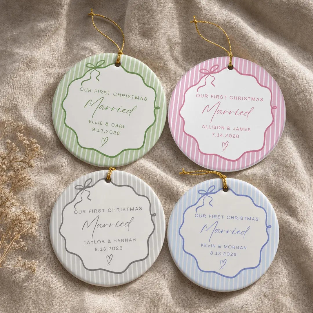 Four round white ceramic First Christmas Married ornaments with pinstripe bow frames in green, pink, gray, and blue and personalized names and date