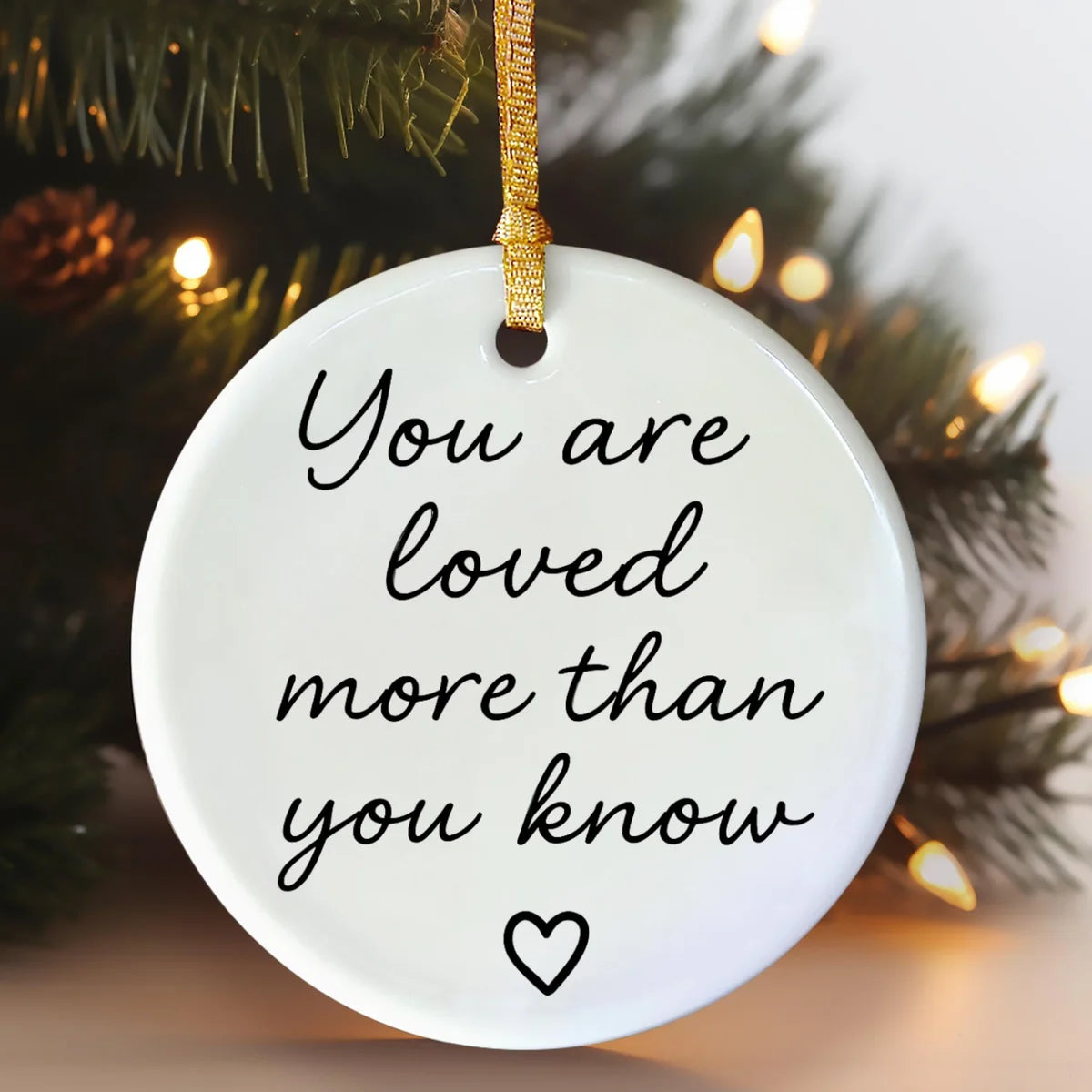 round ceramic ornament with the visible You Are Loved More Than You Know message.