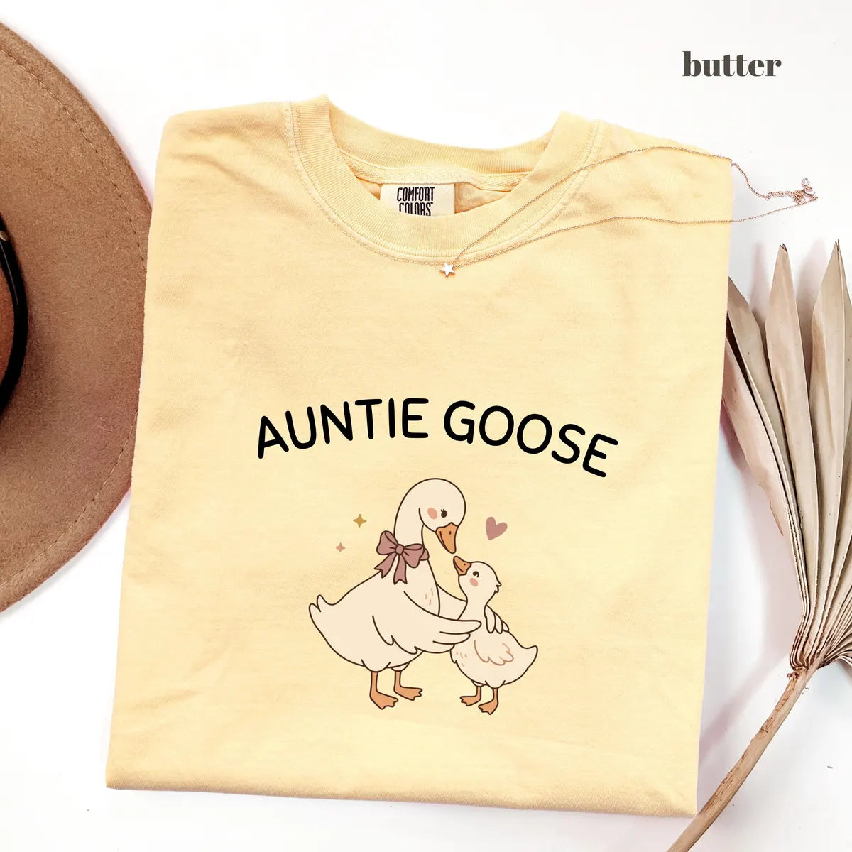 Butter Comfort Colors 1717 T-shirt with Auntie Goose design worn by a model