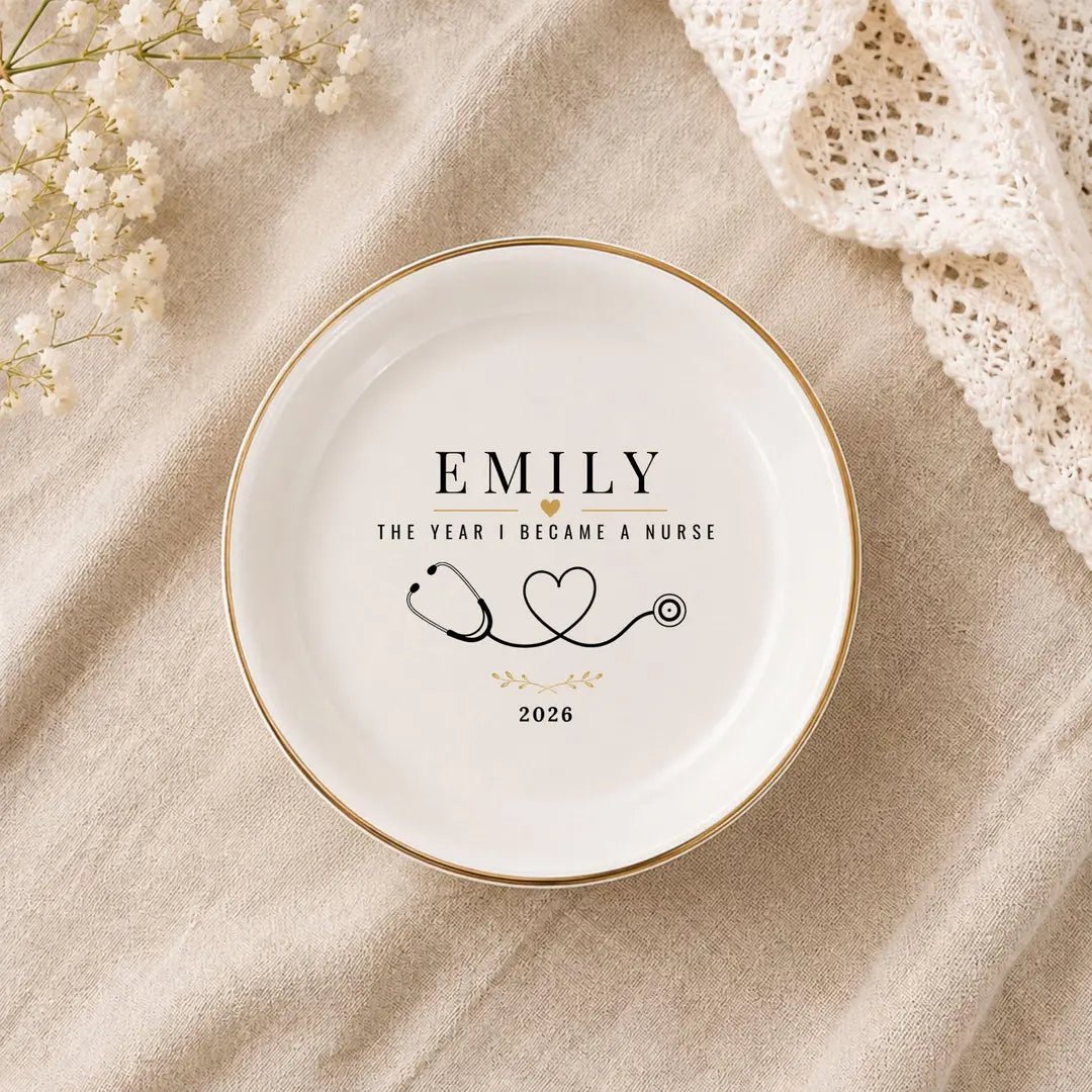 Round ceramic nurse ring dish with gold rim, a name, stethoscope heart design and a year