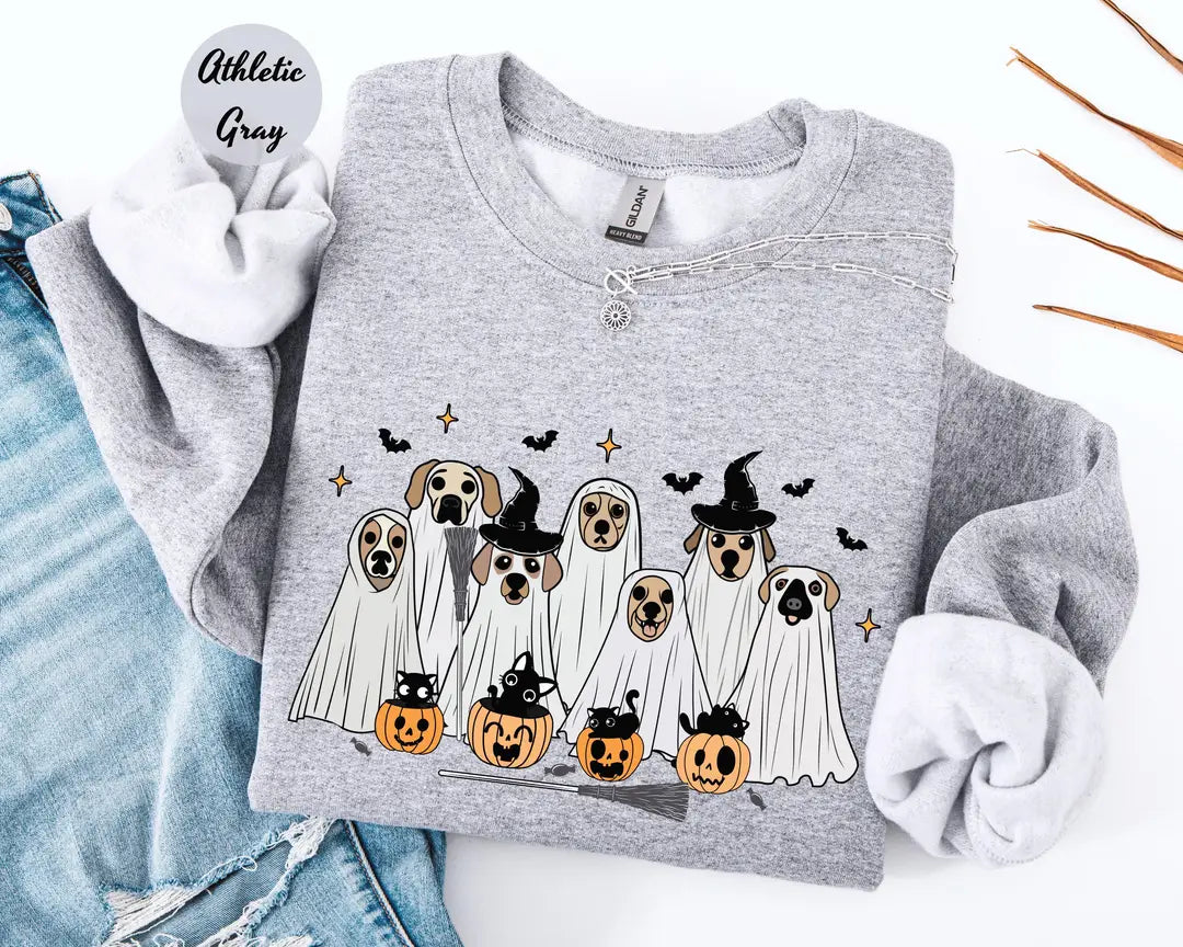 Athletic Gray crewneck sweatshirt with printed ghost dogs with witch hats, pumpkins and bats, flat lay view.