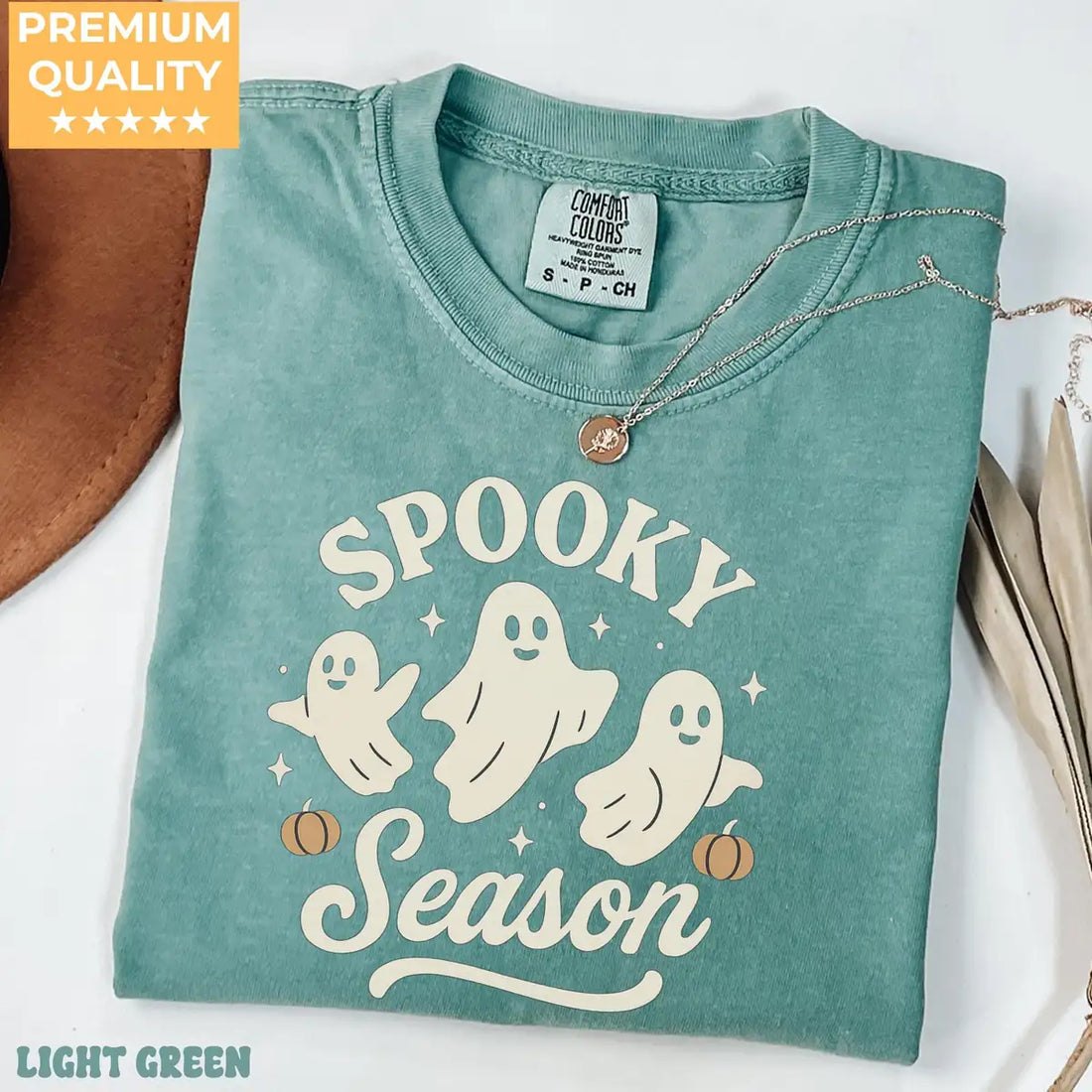 Comfort Colors T-shirt in Light Green color featuring Spooky Season trio ghosts graphic