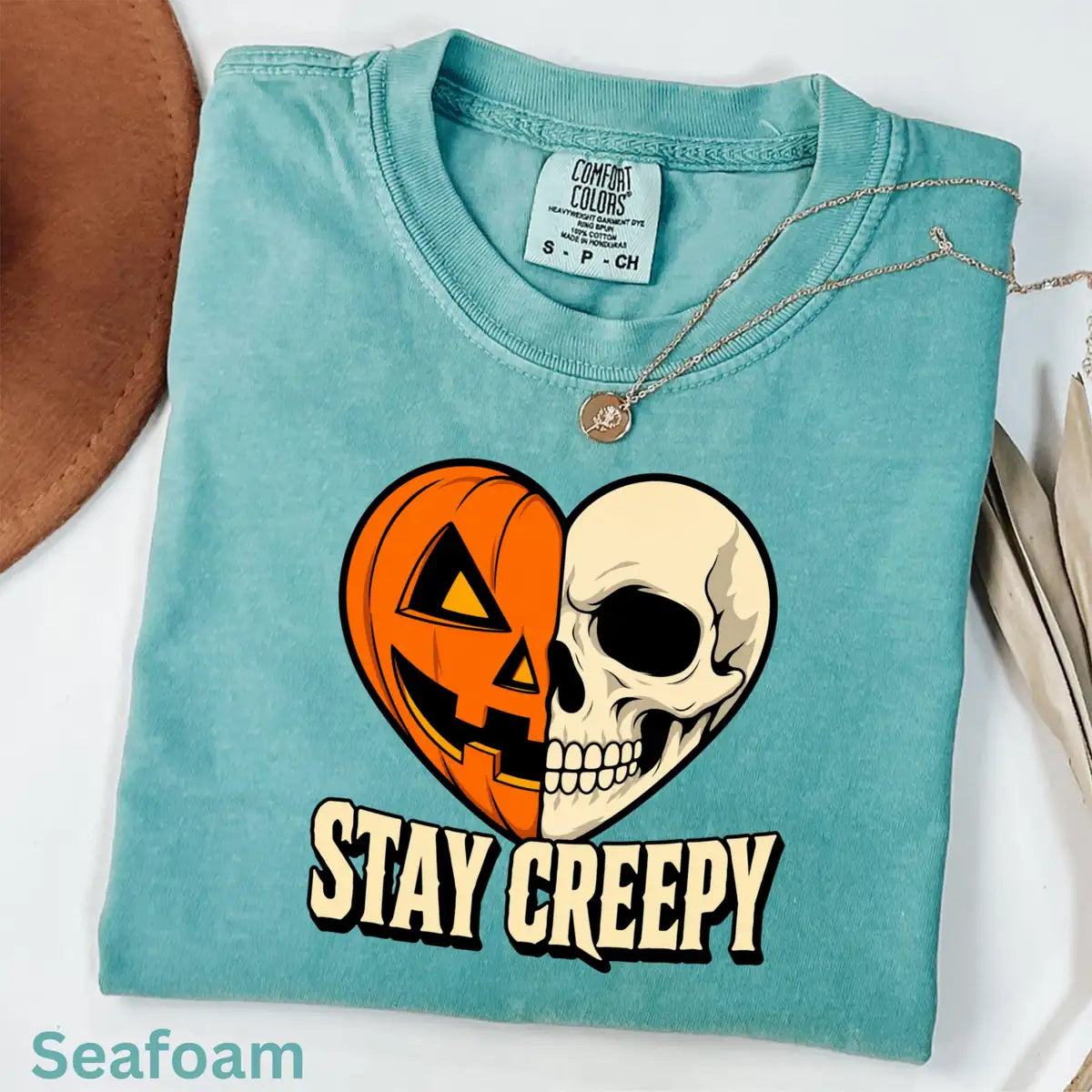 Seafoam Comfort Colors T-shirt with Stay Creepy Pumpkin Skeleton Heart Halloween artwork