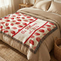 Close-up of the personalized strawberry scallop woven blanket with texture and fringe detail