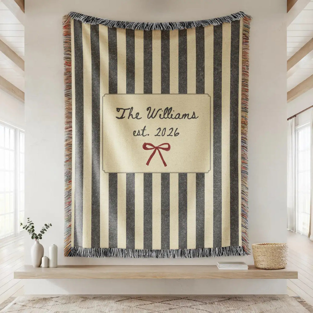 Close-up of the personalized striped bow woven blanket with texture and fringe detail