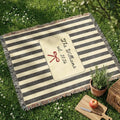 Personalized striped bow woven blanket shown in a styled room setting