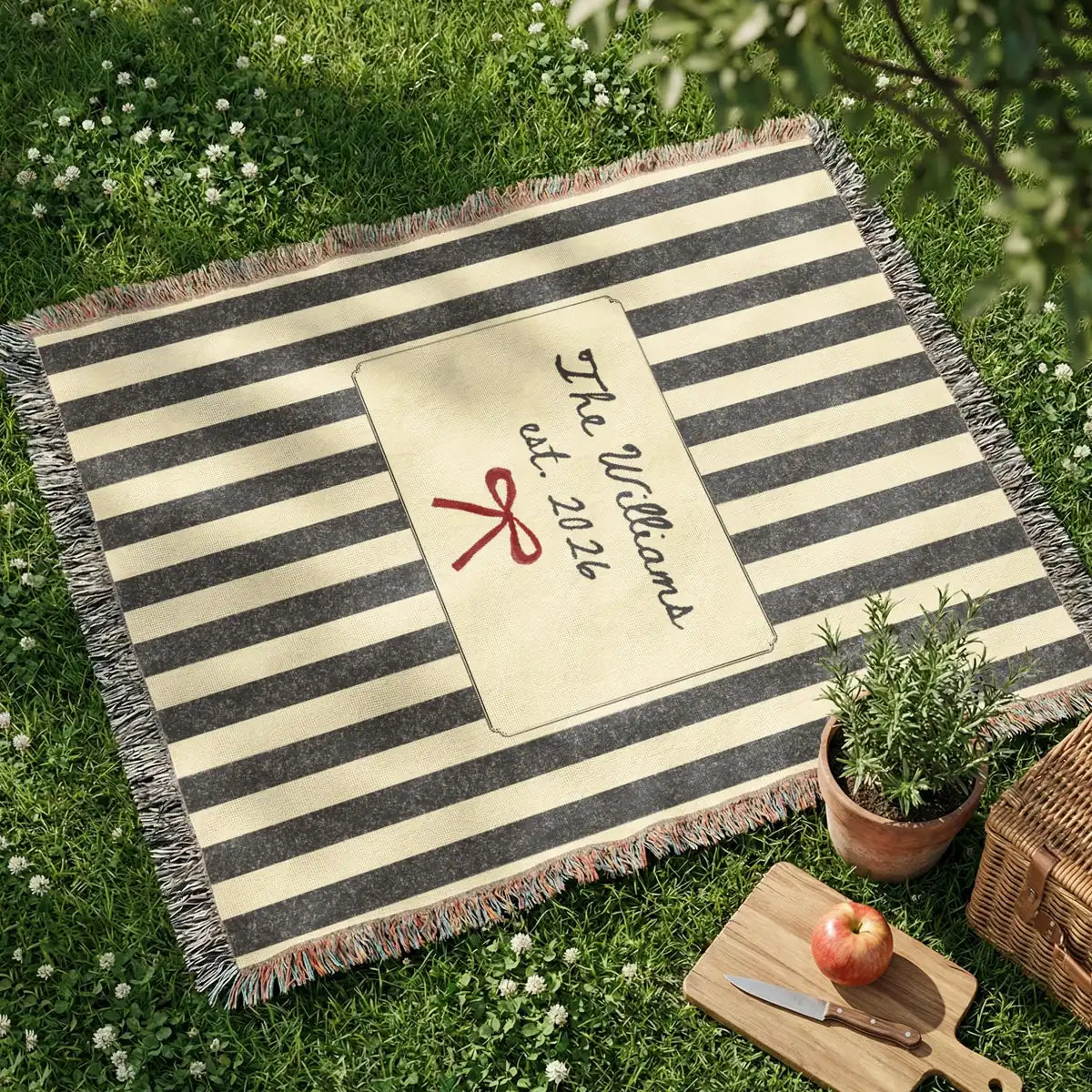 Personalized striped bow woven blanket shown in a styled room setting