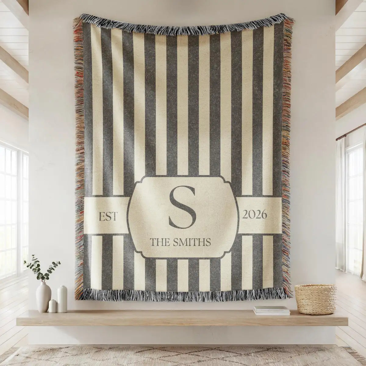 Close-up of the personalized striped crest woven blanket with texture and fringe detail