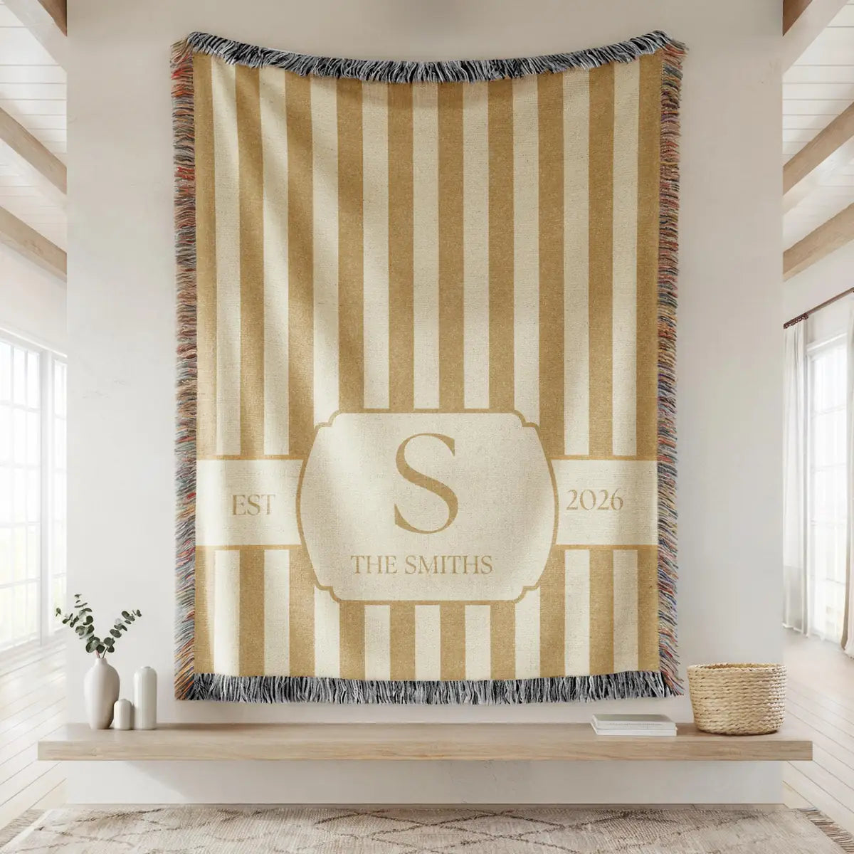 Close-up of the personalized striped crest woven blanket with texture and fringe detail