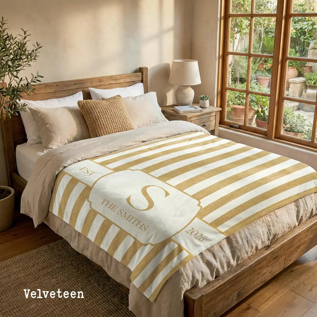 Close-up of the personalized striped crest woven blanket with texture and fringe detail