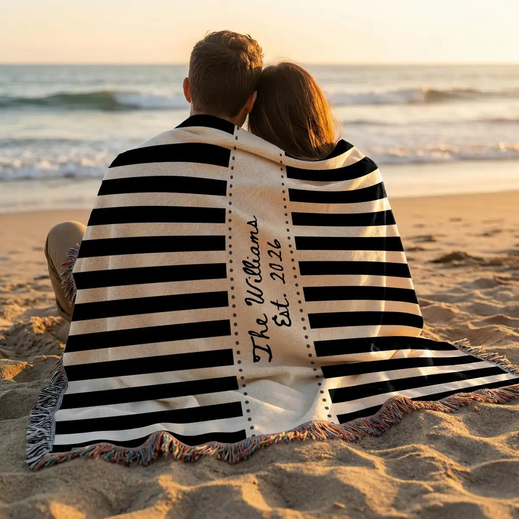 Personalized striped frame woven blanket shown in a styled room setting