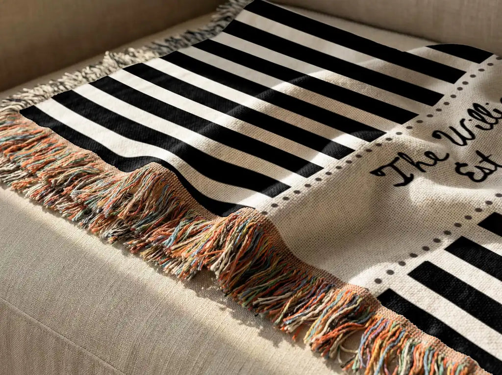 Personalized striped frame woven blanket shown in a styled room setting