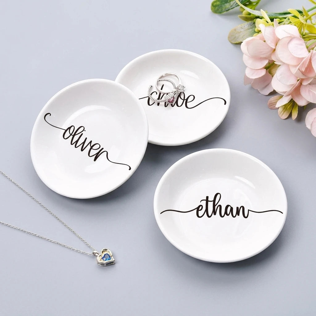 Close-up detail of swash calligraphy personalized name on ring dish