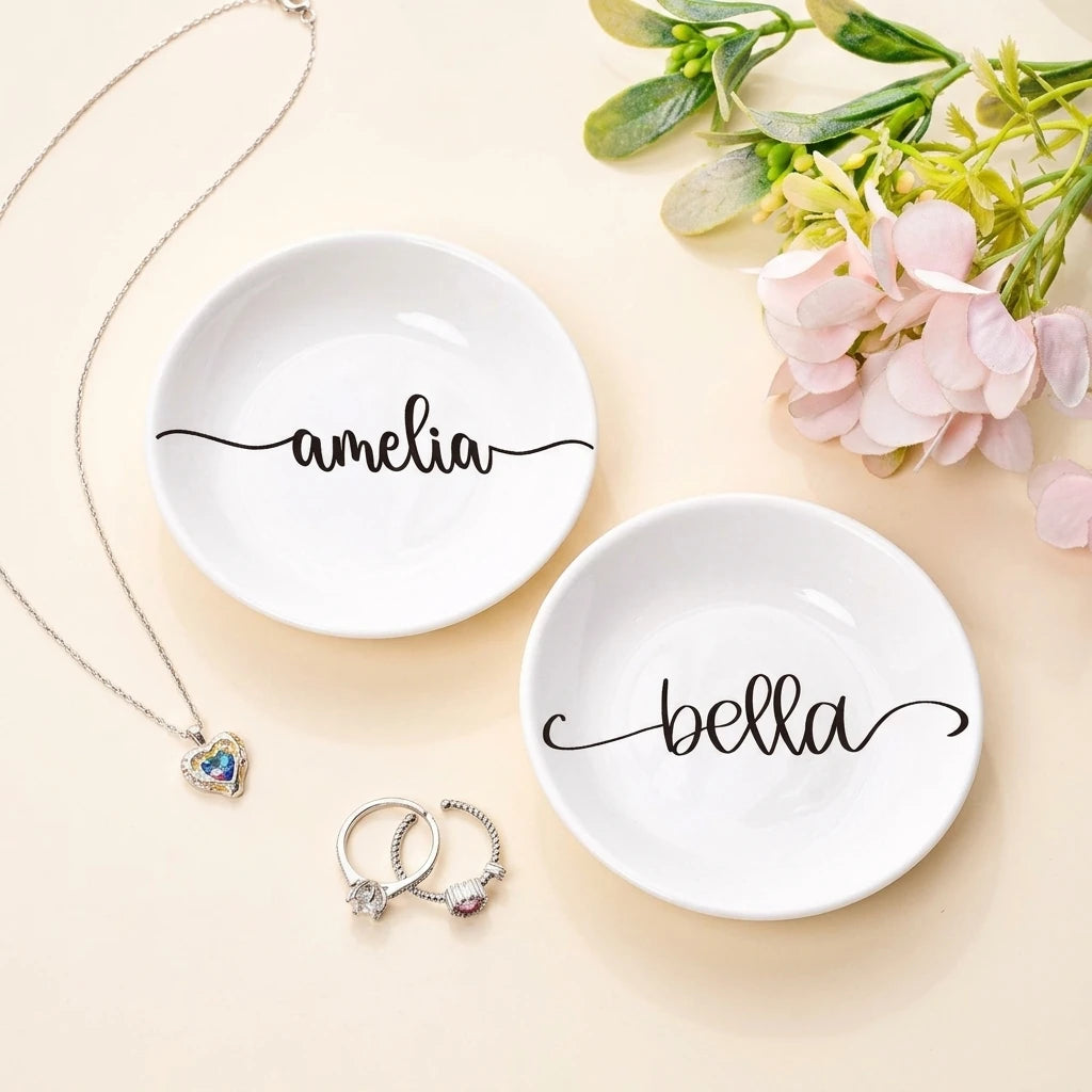 Round personalized engagement ring dish with swash calligraphy name in black
