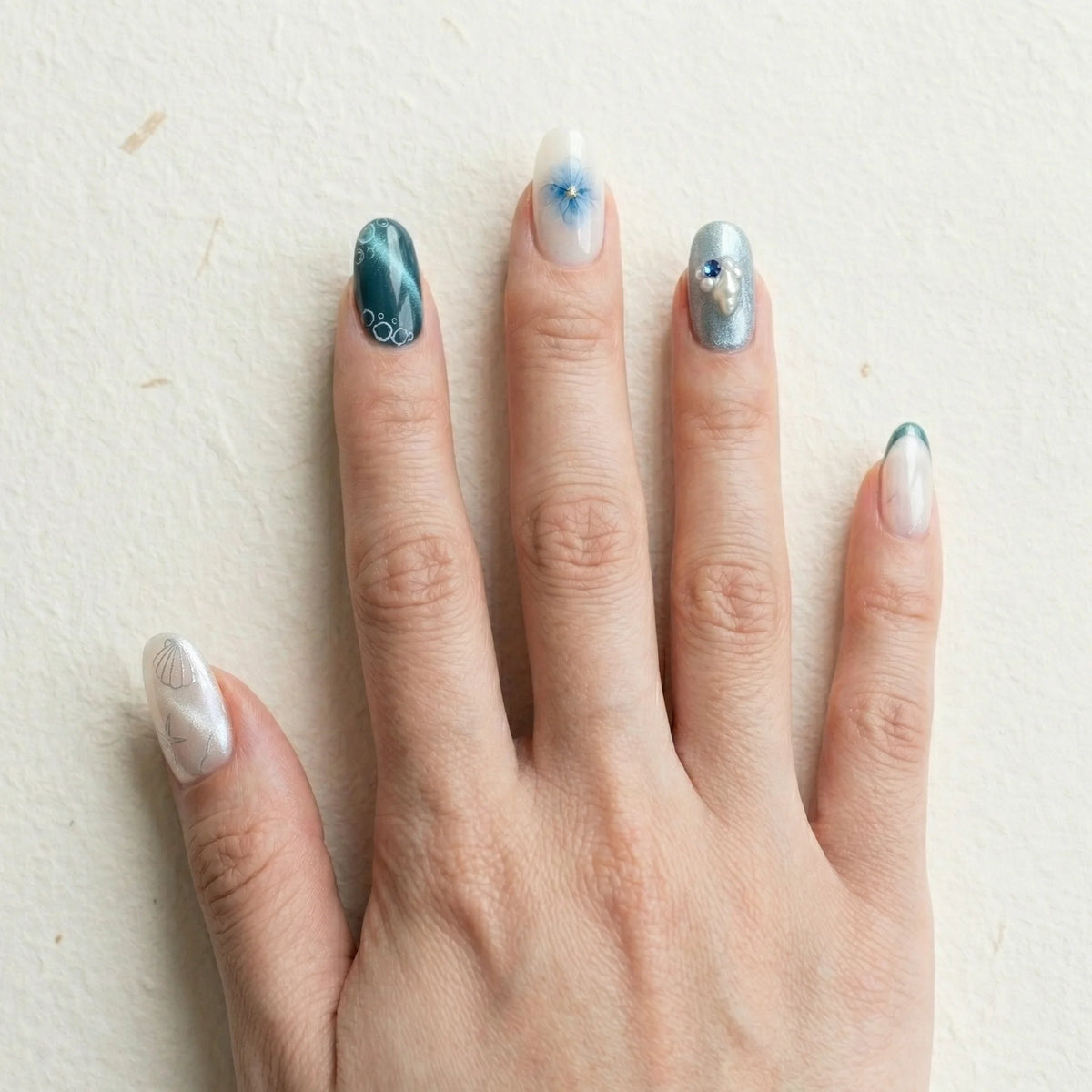 teal cat eye 3d almond medium press on nails ocean seashell charm lifestyle 02