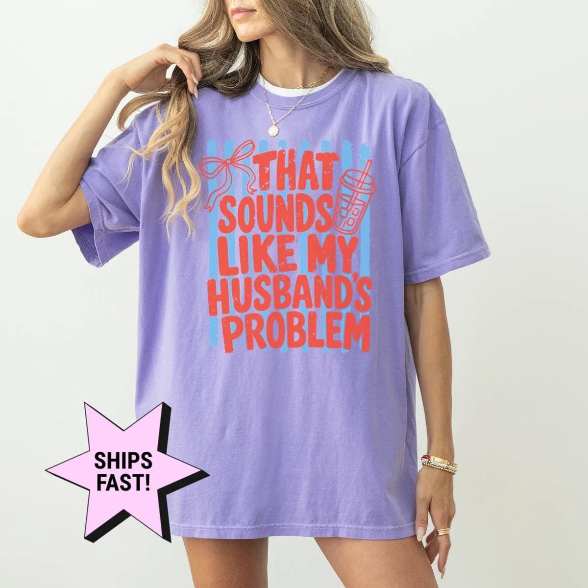 Woman in a Violet Comfort Colors tee, hand in her hair, with red that sounds like my husband's problem on blue stripes