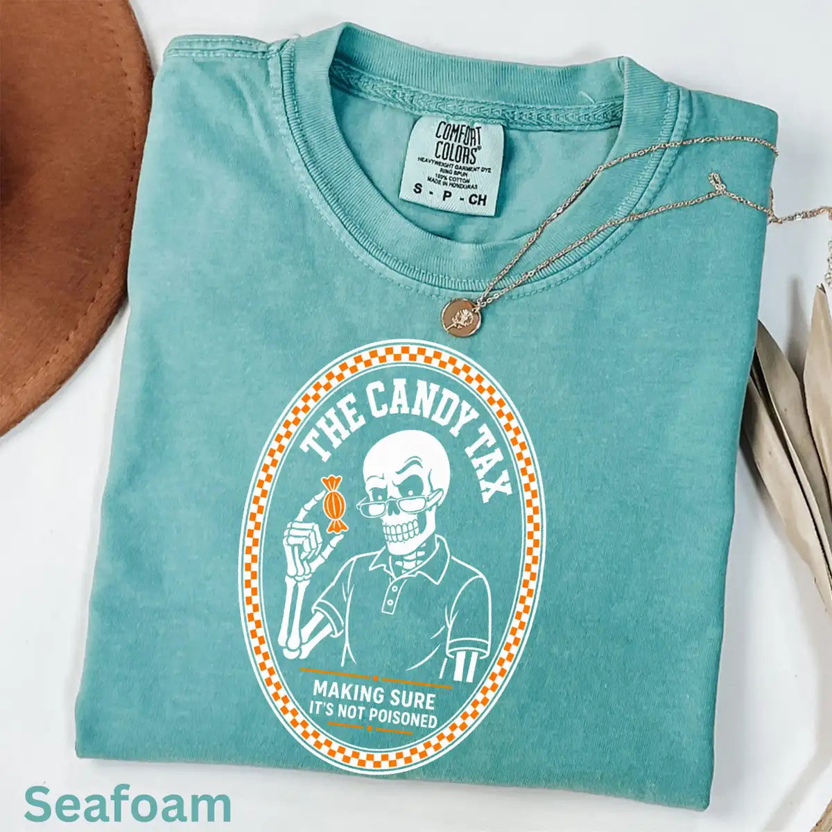Comfort Colors T-shirt in Yam featuring skeleton dad candy tax graphic