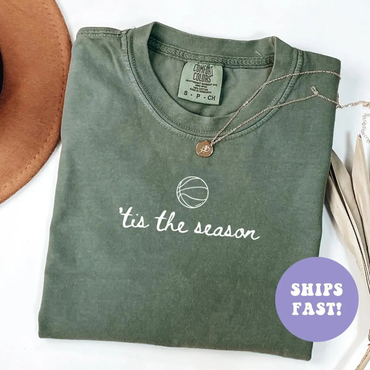 Folded Moss green Comfort Colors tee with a line-art basketball over the cursive words 'tis the season