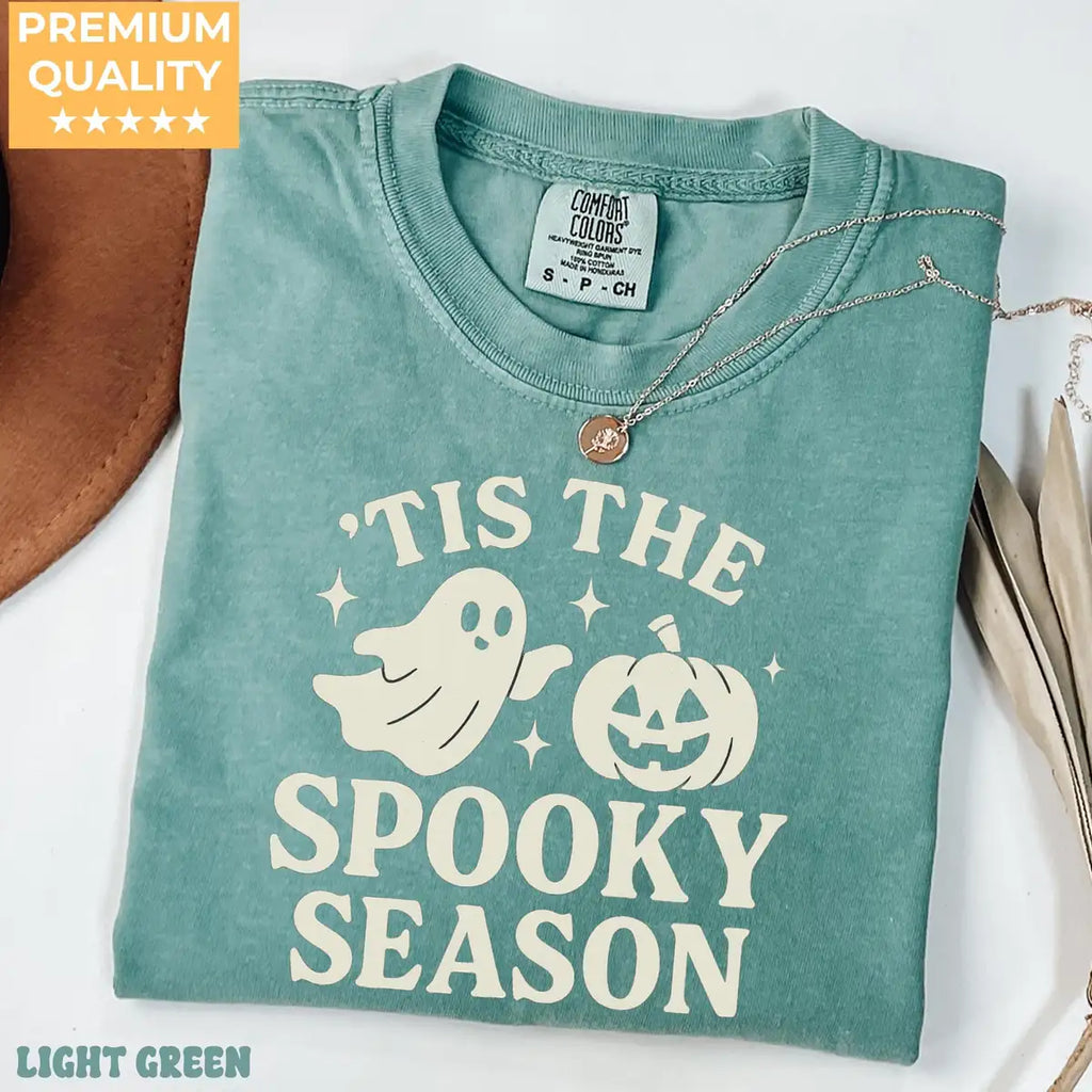 Comfort Colors T-shirt in Light Green color featuring Tis The Spooky Season ghost and pumpkin graphic