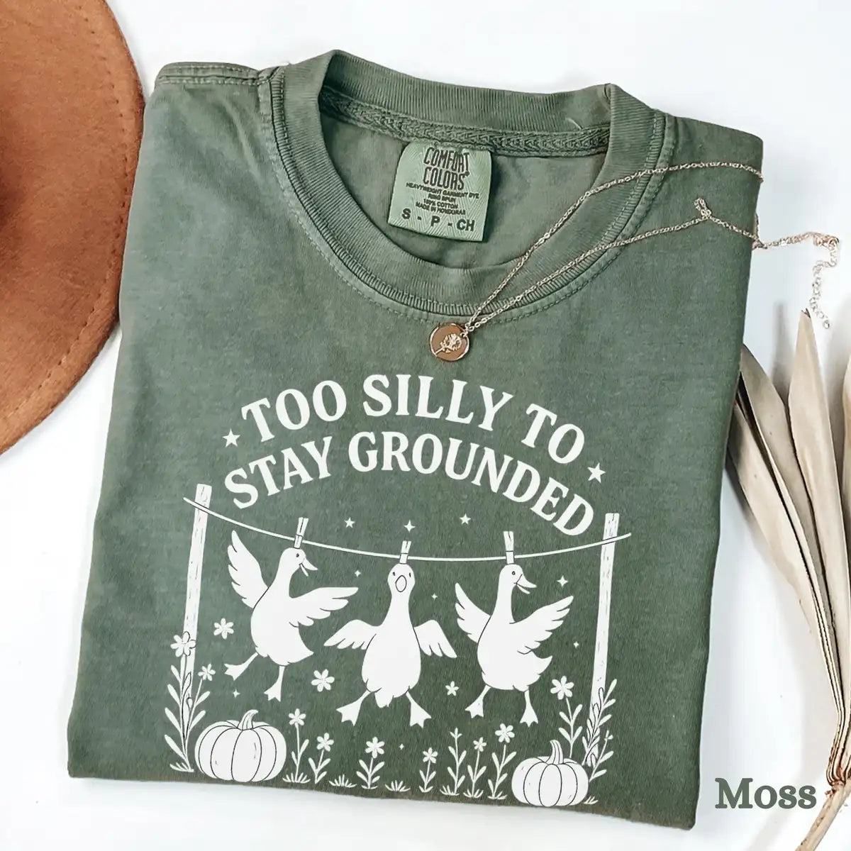 Comfort Colors T-shirt in Ivory color featuring Too Silly To Stay Grounded geese graphic