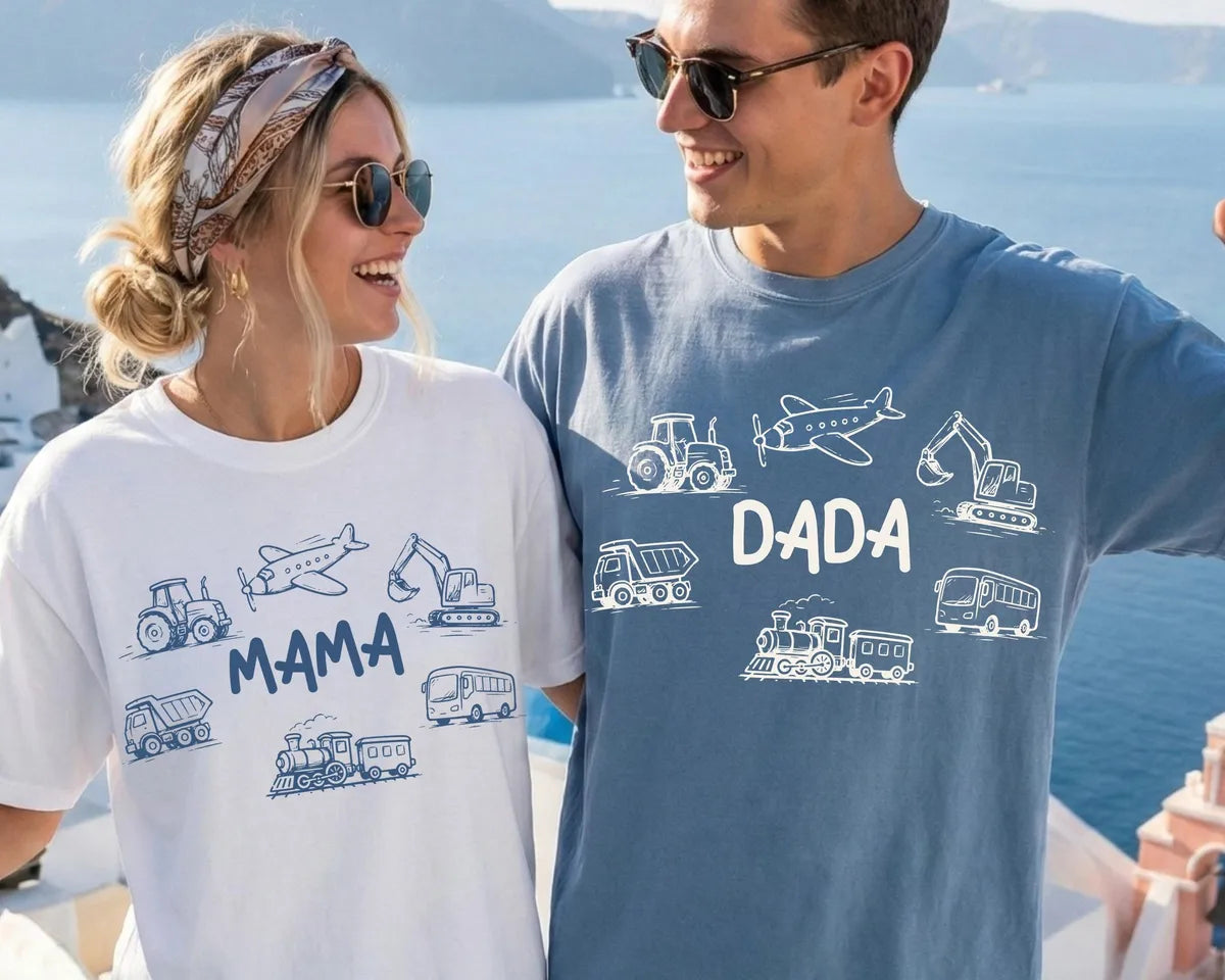 White and Blue Jean Comfort Colors tees with MAMA and DADA among sketched vehicles, worn by a smiling couple by the sea