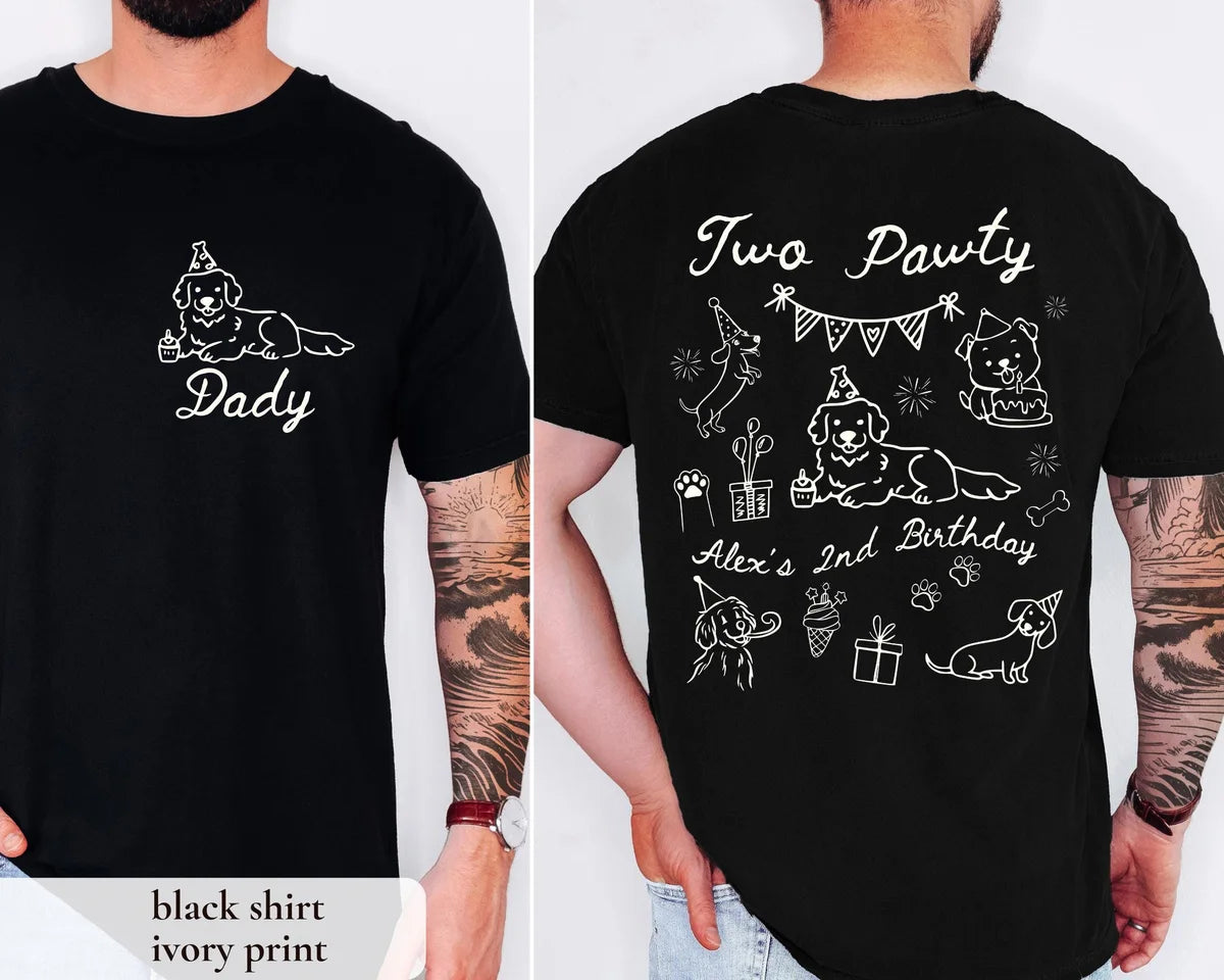 Man in a Black Comfort Colors tee, front with an ivory dog and Dad script, back with Two Pawty and a party banner