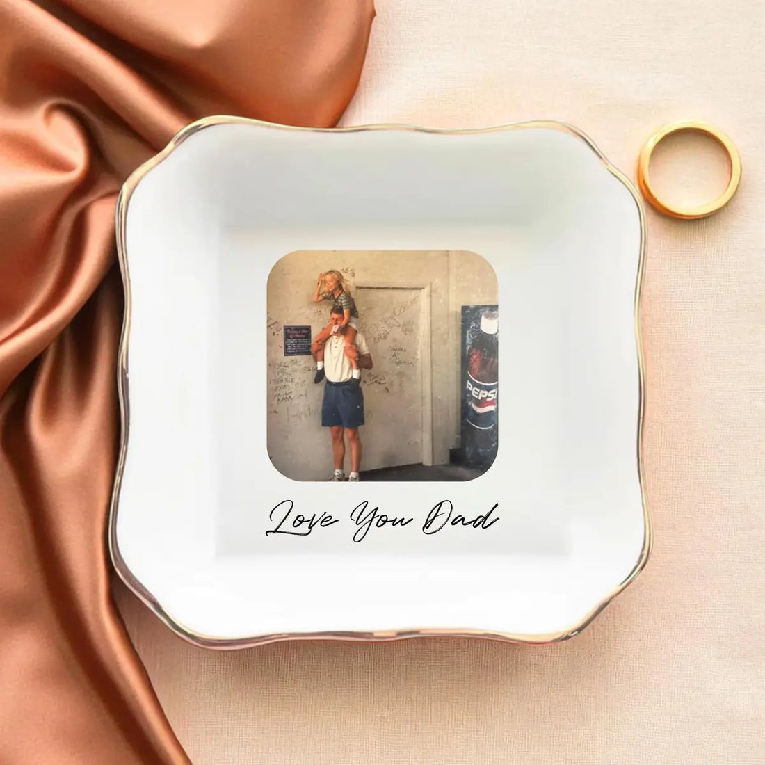 Close-up detail of glossy ceramic finish and gold rim on personalized family trinket tray