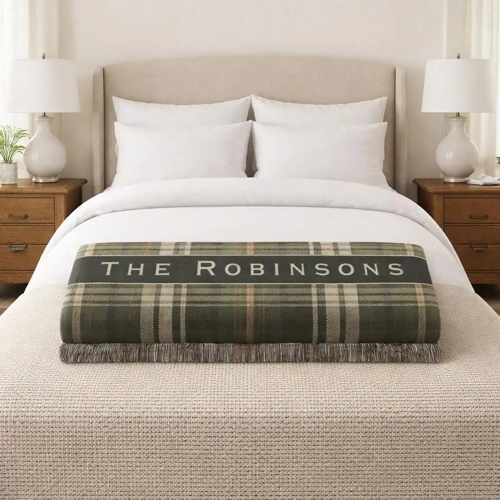 Close-up of the personalized vintage plaid woven blanket with monogram and fringe detail