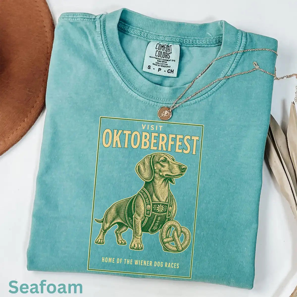 Woman wearing Seafoam Visit Oktoberfest Dachshund - Wiener Dog Halloween Comfort Colors T-Shirt