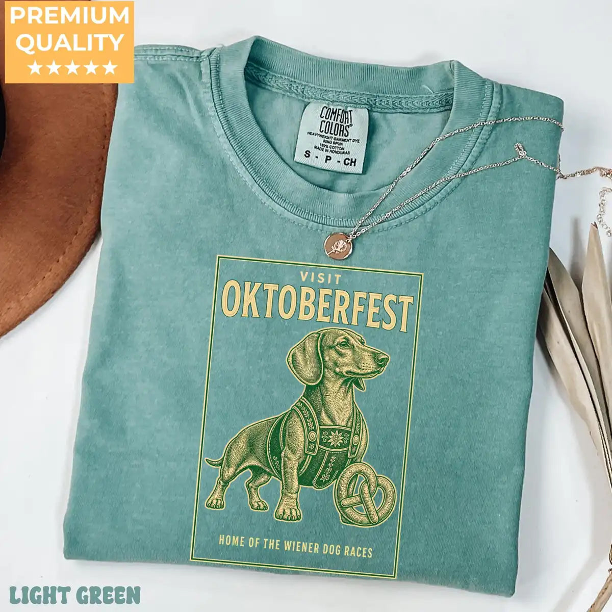 Light Comfort Colors T-shirt mockup showing Visit Oktoberfest Dachshund Halloween design
