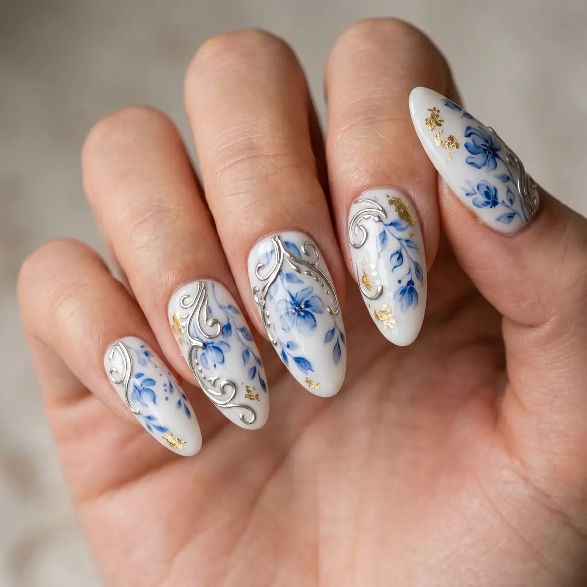 white blue hand painted almond press on nails gold foil flower silver swirl lifestyle 02