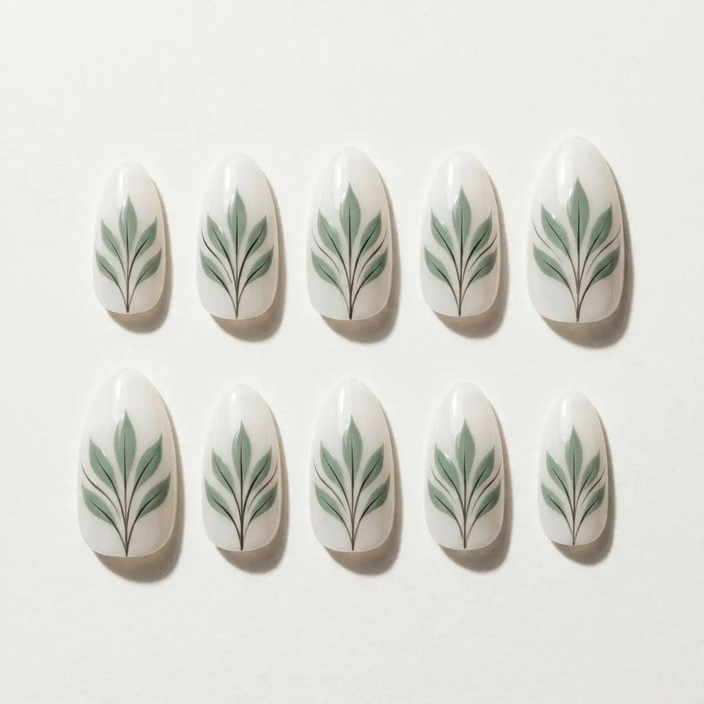 white sage green hand painted almond press on nails leaf flat lay 04