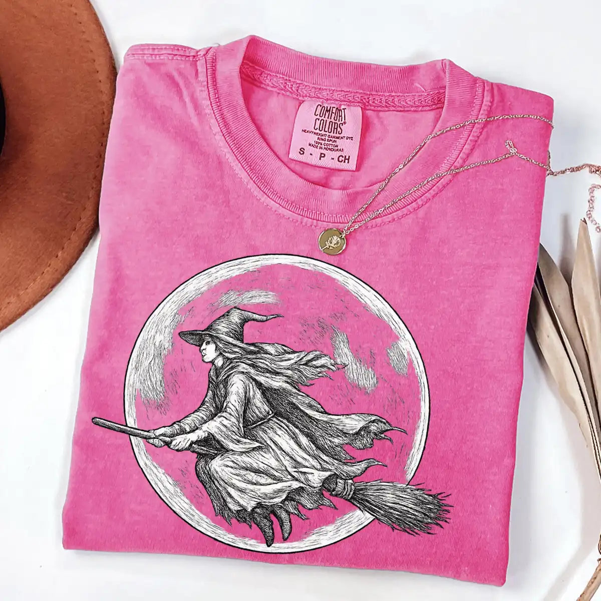 Comfort Colors T-shirt in Crunchberry featuring flying witch graphic