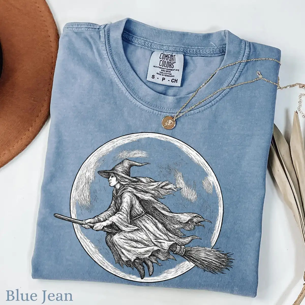 Comfort Colors T-shirt in Blue Jean featuring flying witch graphic