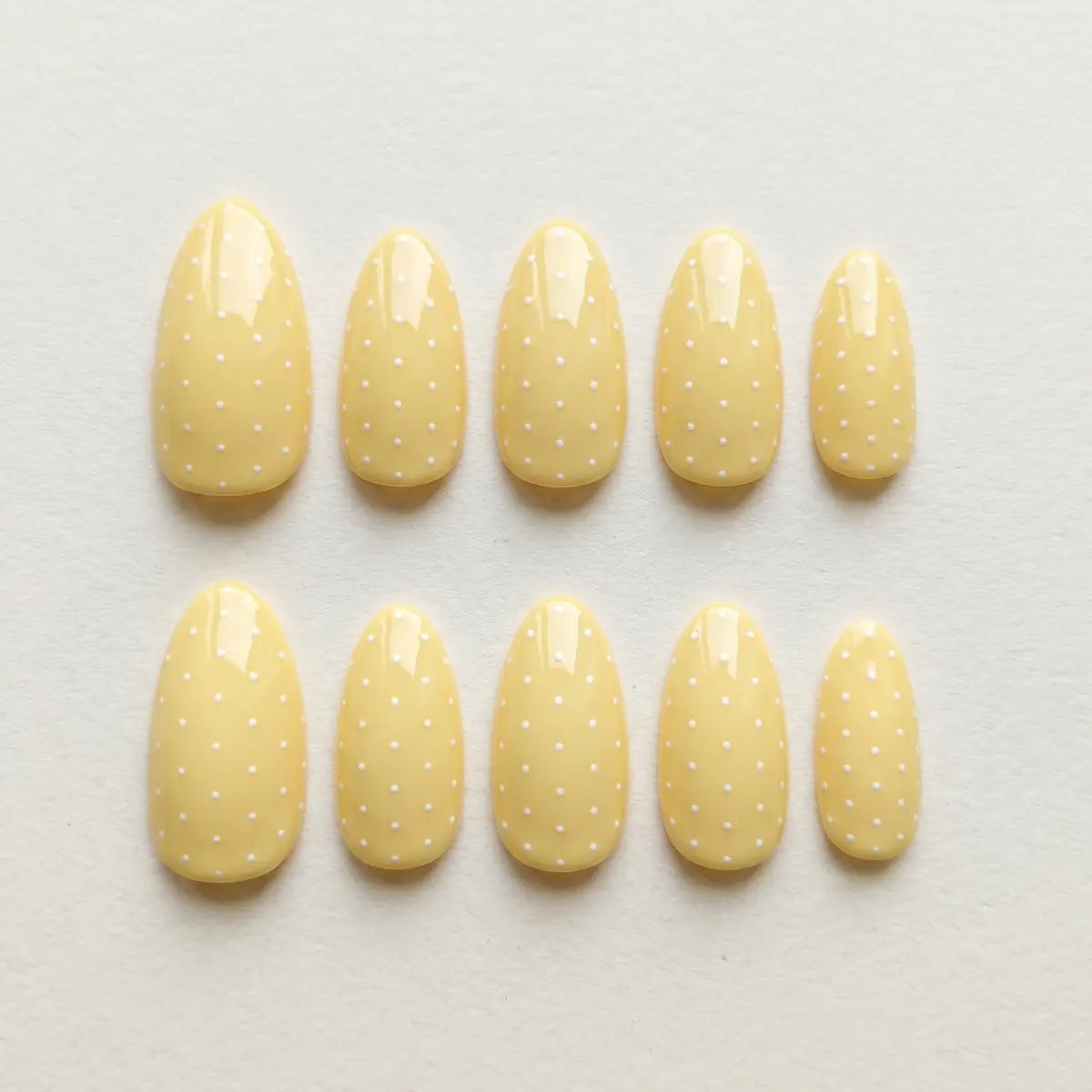 yellow white hand painted almond press on nails polka dot lifestyle 02